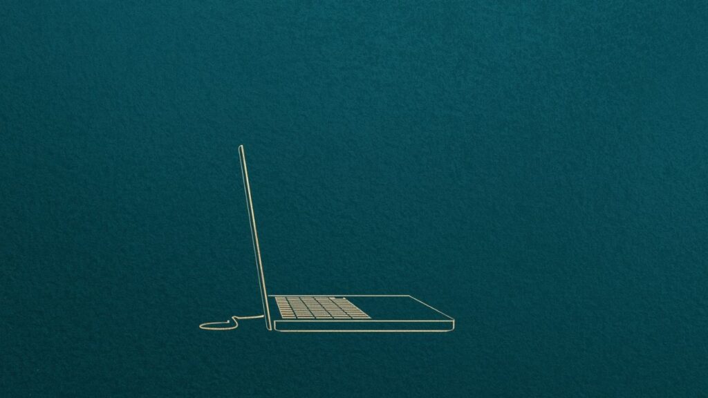 an open laptop on a teal background