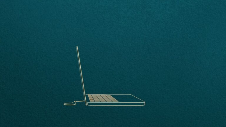 open laptop on a teal background